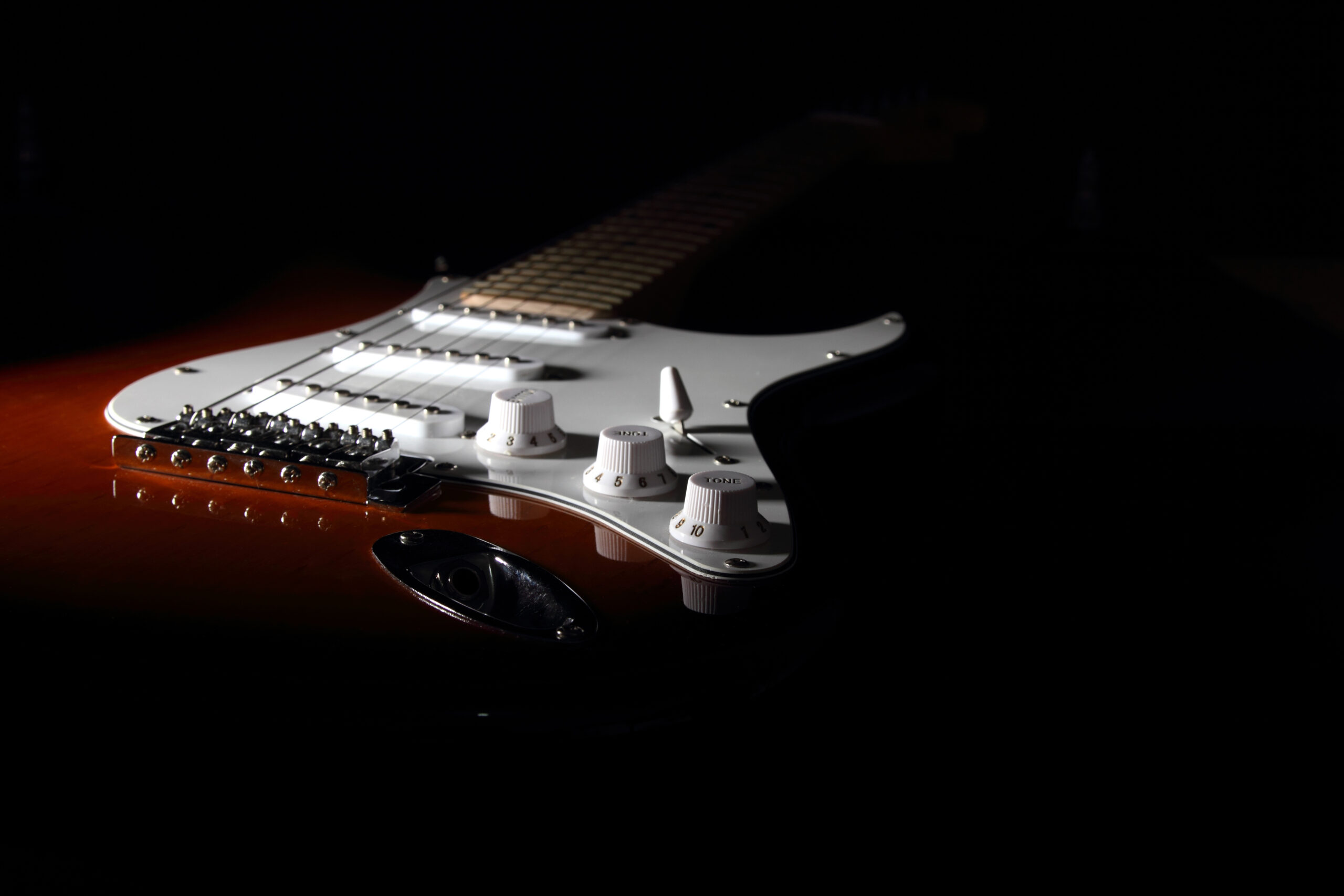 Electric guitar on dark background